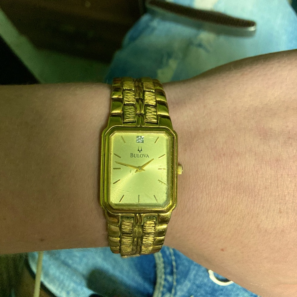 Men’s Bulova gold nugget with diamond watch